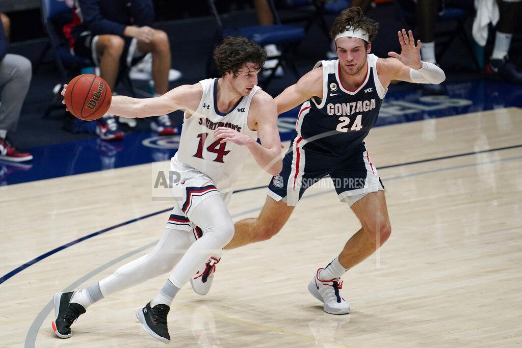 Jeff Chiu Saint Mary's forward Kyle Bowen (14) drives against Gonzaga forward Corey Kispert (24) during the first half of an NCAA college basketball game in Moraga, Calif., Saturday, Jan. 16, 2021. (AP Photo/Jeff Chiu)