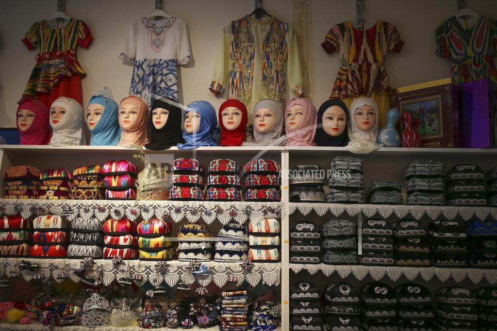 Emrah Gurel A clothes shop belonging to a member of the Uighur community in Istanbul, Tuesday, Feb. 2, 2021. Because of shared cultural ties, Turkey has long been a safe haven for the Uighurs, a Turkic group native to China's far west Xinjiang region. Opposition legislators in Turkey are accusing Ankara's leaders of secretly selling out Uighurs to China in exchange for coronavirus vaccines. (AP Photo/Emrah Gurel)