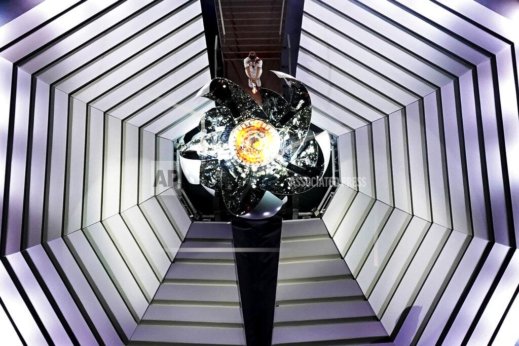 Morry Gash Naomi Osaka lights the Olympic cauldron during the opening ceremony at the Olympic Stadium at the 2020 Summer Olympics, Friday, July 23, 2021, in Tokyo. (AP Photo/Morry Gash)