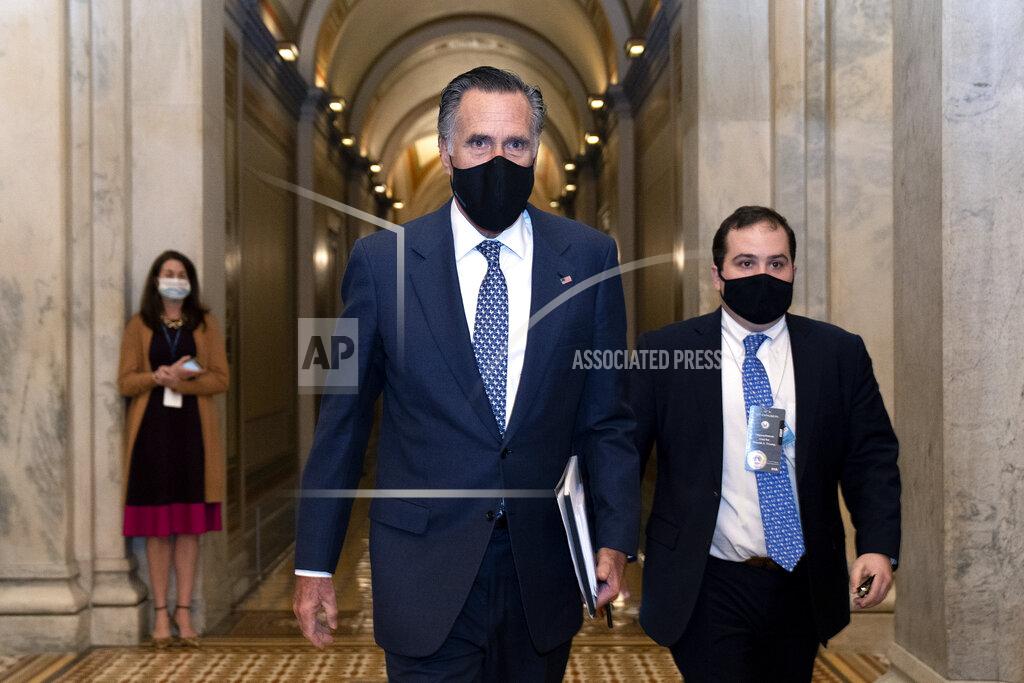 Stefani Reynolds Sen. Mitt Romney, R-Utah, center, departs Capitol Hill after the Senate acquitted former President Donald Trump in his second impeachment trial in the Senate at the U.S. Capitol in Washington, Saturday, Feb. 13, 2021. (Stefani Reynolds/Pool via AP)