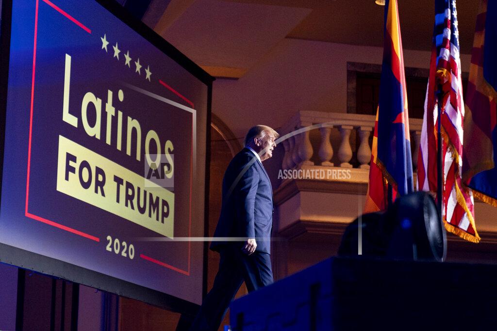Andrew Harnik FILE - In this Sept. 14, 2020 file photo, President Donald Trump arrives for a Latinos for Trump Coalition roundtable at Arizona Grand Resort & Spa in Phoenix. President Donald Trump is putting up a fight for Latino voters in key swing states with Democratic candidate Joe Biden. Polls show Biden with a commanding overall lead with Hispanic voters, a diverse group that defies neat political categories. Still, about 3 in 10 registered Latino voters nationwide back Trump, roughly consistent with how Latinos voted in 2018 congressional elections and in 2016. Latino men, like men of other races, support Trump more than Hispanic women. (AP Photo/Andrew Harnik, File)