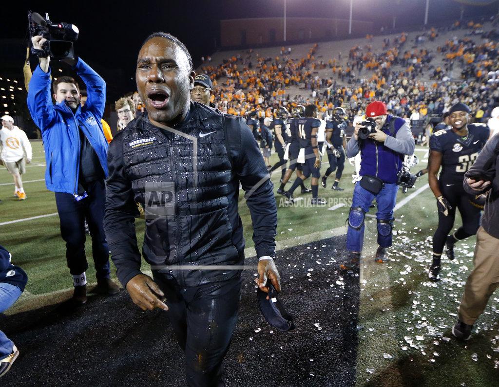 Mark Humphrey Vanderbilt head coach Derek Mason reacts after being doused after his team defeated Tennessee in an NCAA college football game Saturday, Nov. 24, 2018, in Nashville, Tenn. (AP Photo/Mark Humphrey)