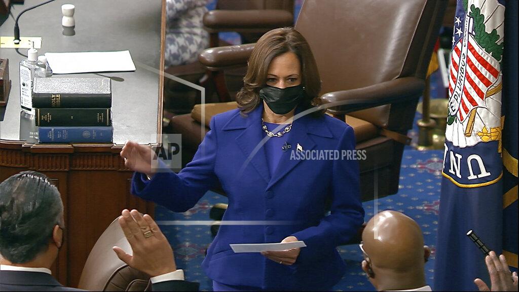 Uncredited In this image from video, Vice President Kamala Harris swears in Sen. Raphael Warnock, D-Ga., Sen. Alex Padilla, D-Calif., and Sen. Jon Ossoff, D-Ga., on the floor of the Senate Wednesday, Jan. 6, 2021, on Capitol Hill in Washington. (Senate Television via AP)