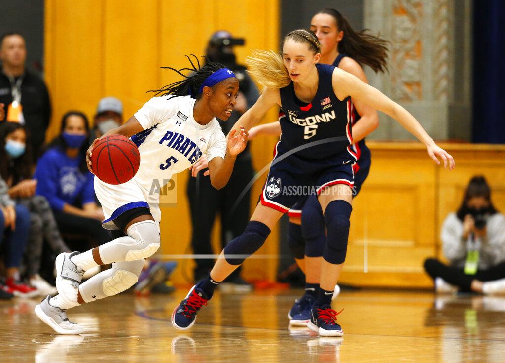 Noah K. Murray Seton Hall guard Mya Jackson, left, drives to the basket against Connecticut guard Paige Bueckers, front right, during the second half of an NCAA college basketball game on Friday, Dec. 3, 2021, in South Orange, N.J. (AP Photo/Noah K. Murray)