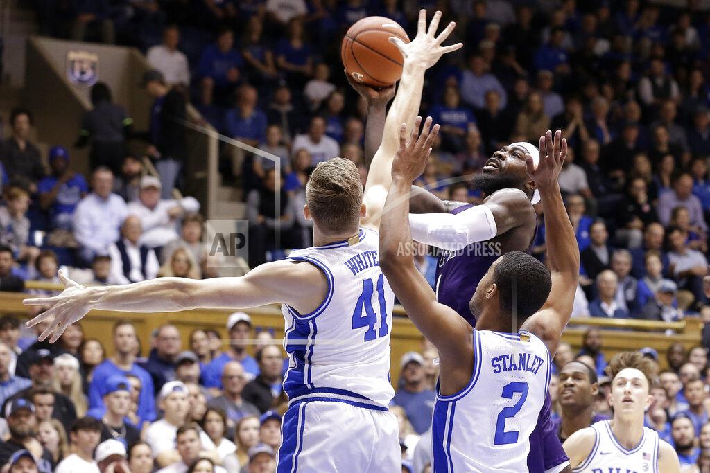 Gerry Broome Stephen F. Austin guard Kevon Harris drives to the basket against Duke forward Jack White (41) and guard Cassius Stanley (2) during the first half of an NCAA college basketball game in Durham, N.C., Tuesday, Nov. 26, 2019. (AP Photo/Gerry Broome)