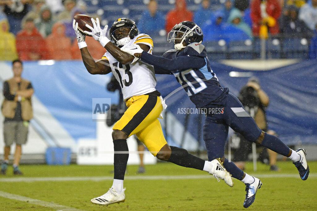 Mark Zaleski Pittsburgh Steelers wide receiver James Washington (13) catches a 41-yard touchdown as he is defended by Tennessee Titans defensive back Kenneth Durden (20) in the first half of a preseason NFL football game Sunday, Aug. 25, 2019, in Nashville, Tenn. (AP Photo/Mark Zaleski)