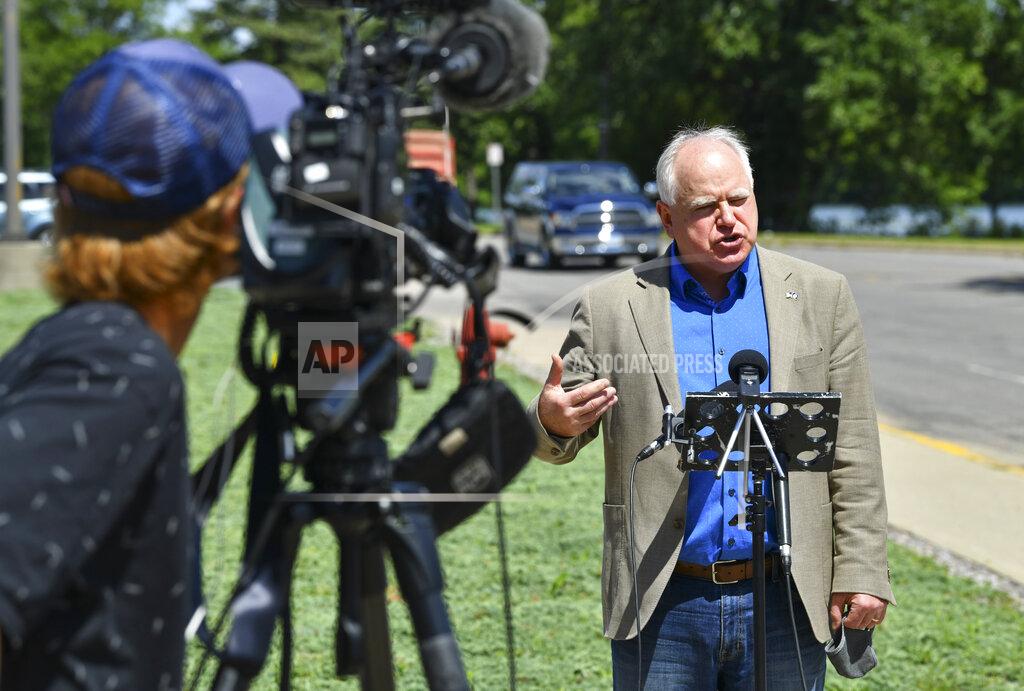 Dave Schwarz Minnesota Gov. Tim Walz answers questions during a press conference Tuesday, Aug. 4, 2020, during a stop at Central Minnesota Council on Aging offices in Sartell, Minn. (Dave Schwarz/The St. Cloud Times via AP)