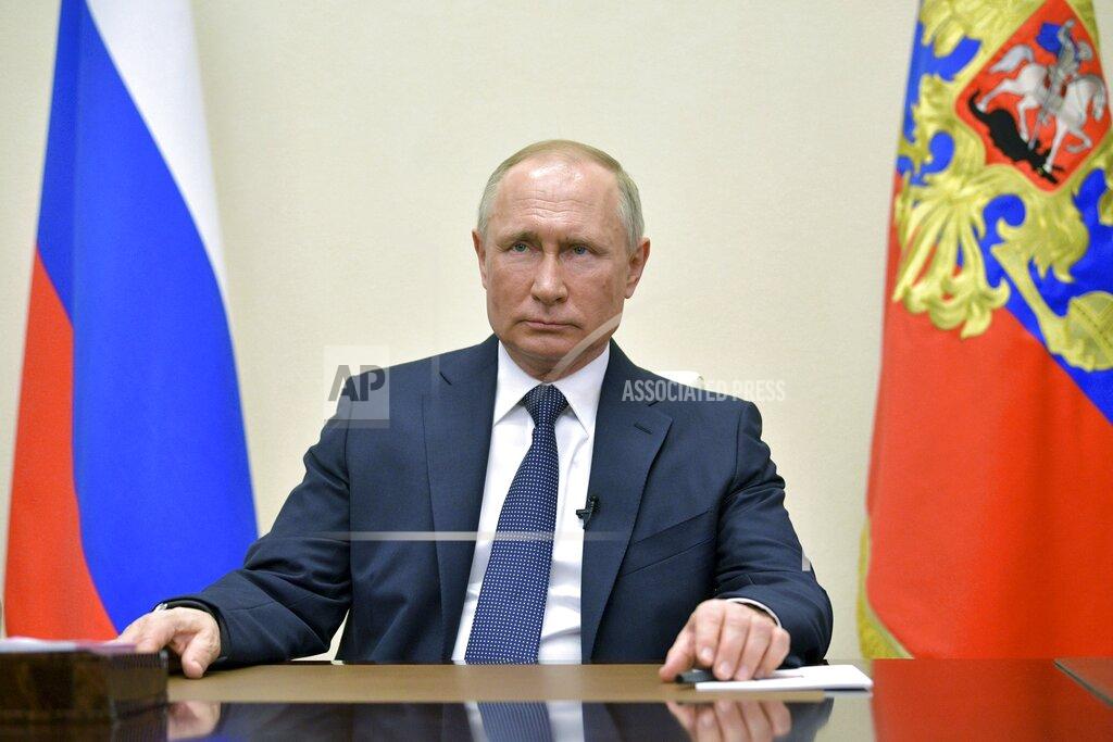 Alexei Druzhinin CAPTION CORRECTS THE DATE Russian President Vladimir Putin addresses Russian citizens on the State Television channels at the Novo-Ogaryovo residence outside Moscow, Russia, Thursday, April 2, 2020. Putin has ordered most Russians to stay off work until the end of the month to curb the spread of the coronavirus. Speaking in a televised address to the nation on Thursday, Putin said he was extending the non-working policy he ordered earlier for this week to remain in force throughout April. (Alexei Druzhinin, Sputnik, Kremlin Pool Photo via AP)