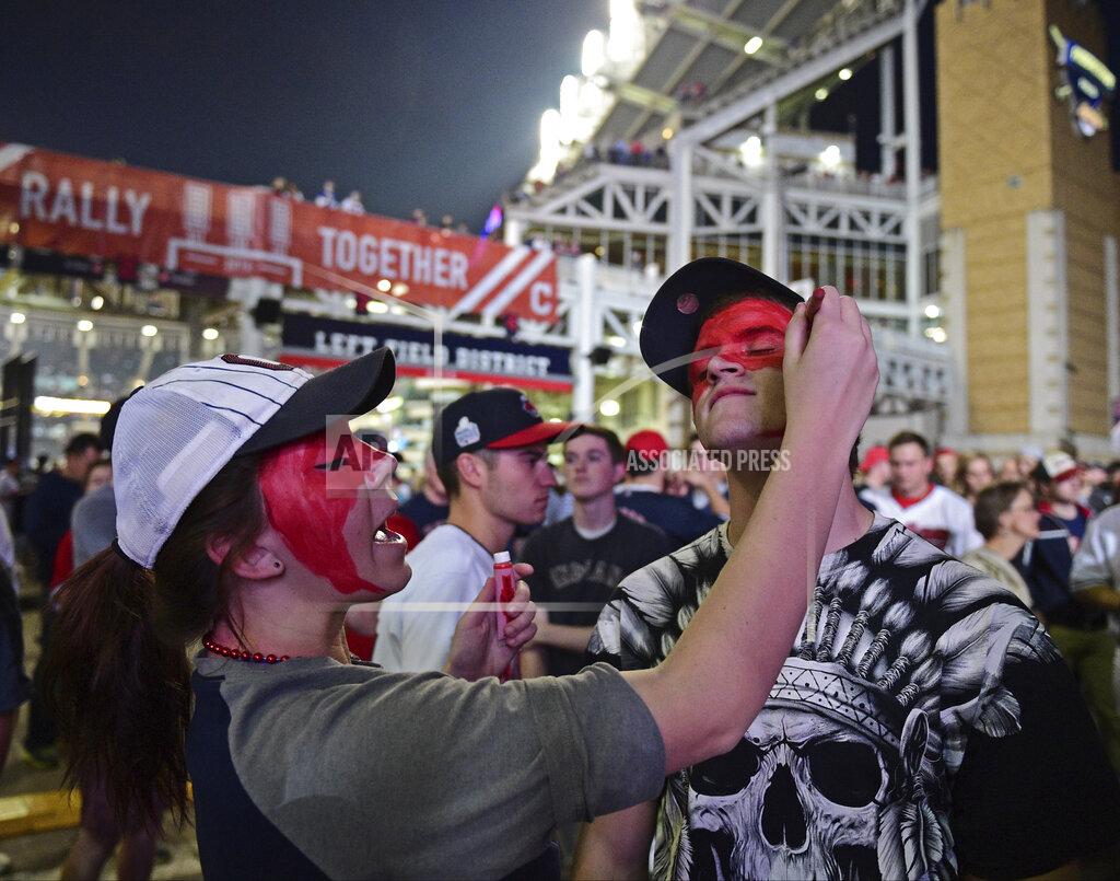 David Dermer FILE - Cleveland Indians fan Leah Krankowski, left, paints the face of Chris Diz during a watch party for Game 7 of the baseball World Series between the Indians and the Chicago Cubs, outside Progressive Field in Cleveland, in this Wednesday, Nov. 2, 2016, file photo. While moving forward with a plan to change their name, the Cleveland Indians said they will not permit fans inside Progressive Field wearing headdresses or inappropriate face paint.
The team announced the new guidelines on Wednesday, March 31, 2021, in advance of Monday's home opener against Detroit. (AP Photo/David Dermer, File)