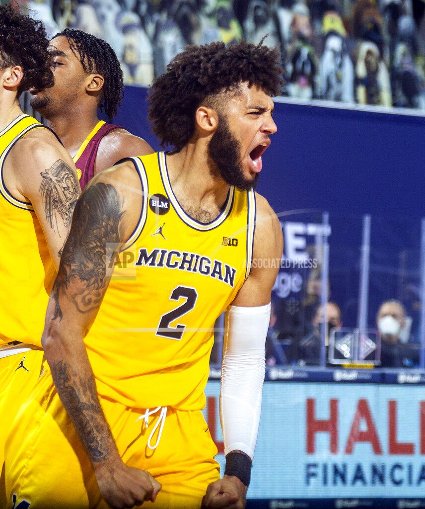 Tony Ding Michigan forward Isaiah Livers (2) reacts after making a basket in the second half of an NCAA college basketball game against Minnesota at Crisler Center in Ann Arbor, Mich., Wednesday, Jan. 6, 2021. (AP Photo/Tony Ding)