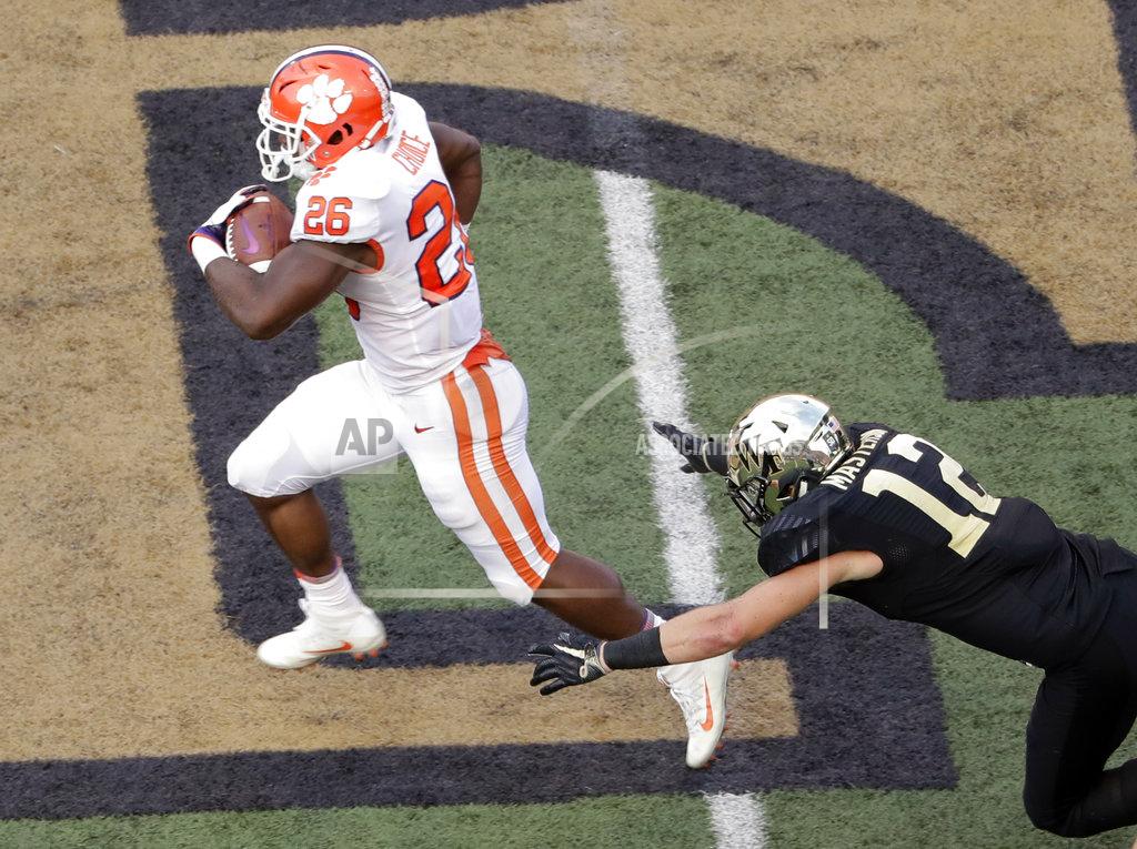 Chuck Burton Clemson's Adam Choice (26) runs past Wake Forest's Luke Masterson (12) for a touchdown during the second half of an NCAA college football game in Charlotte, N.C., Saturday, Oct. 6, 2018. (AP Photo/Chuck Burton)