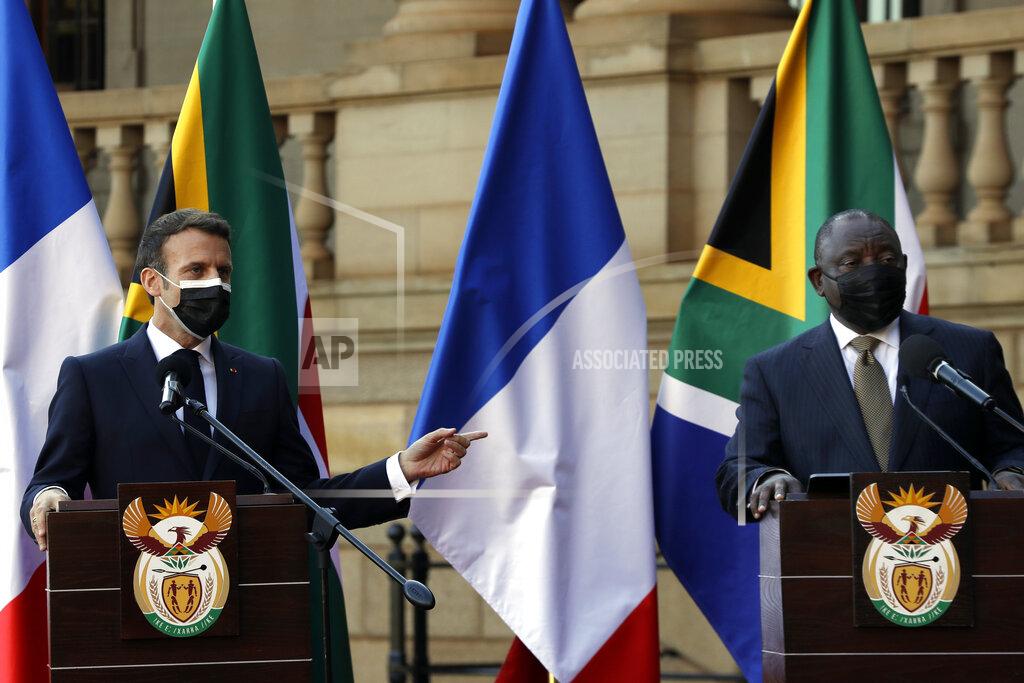 Themba Hadebe South African President Cyril Ramaphosa, right, and his French counterpart Emmanuel Macron speak during a press conference at the government's Union Building, in Pretoria, South Africa, Friday, May 28, 2021. Macron is on a two-day official visit to the country. (AP Photo/Themba Hadebe, Pool)