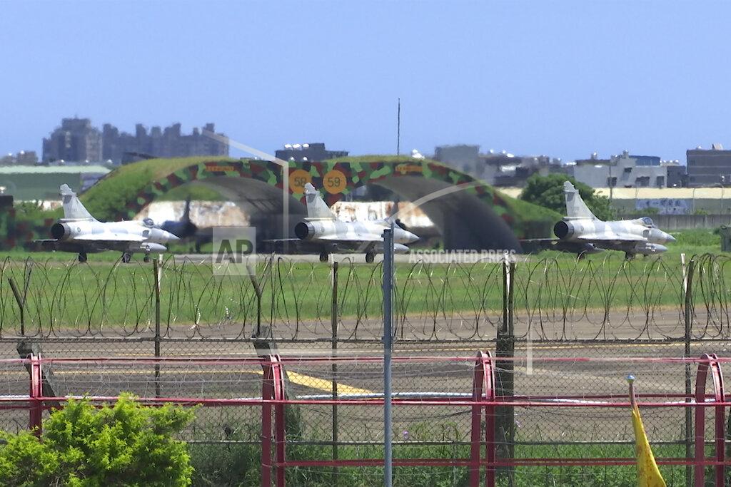 Johnson Lai Taiwan Air Force Mirage fighters sit on the tarmac at an airbase in Hsinchu, Taiwan, Friday, Aug. 5, 2022. China says it summoned European diplomats in the country to protest statements issued by the Group of Seven nations and the European Union criticizing threatening Chinese military exercises surrounding Taiwan. (AP Photo/Johnson Lai)
