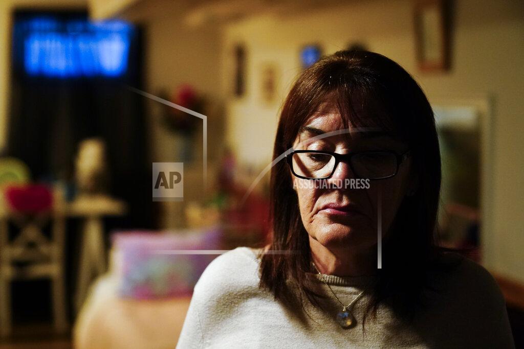 Matt Rourke Patti Burt walks in her sisters' home in Cherry Hill, N.J., Wednesday, March 10, 2021. When the first economic stimulus checks came through, Burt prayed the financial lifeline would ease some of the burdens her daughter, Ashley, was likely facing: "I said, 'God, I hope they're happy.' I knew inside that Ashley was not happy, she was in pain." (AP Photo/Matt Rourke)