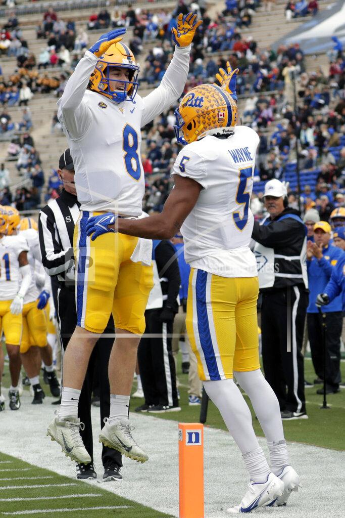 Pittsburgh quarterback Kenny Pickett (8) and wide receiver Jared Wayne (5) celebrate together after Pickett threw a touchdown pass to Wayne during the first half of an NCAA college football game against Duke Saturday, Nov. 6, 2021, in Durham, N.C. (AP Photo/Chris Seward)