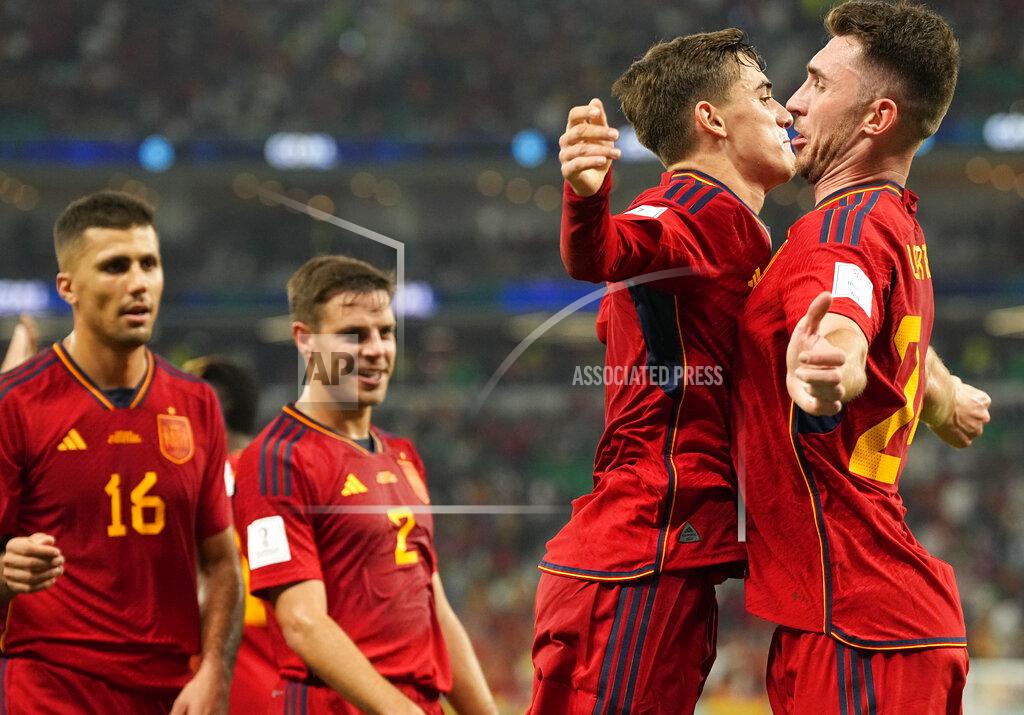Pavel Golovkin Spain's Gavi, second right, celebrates with Aymeric Laporte after scoring his side's fifth goal during the World Cup group E soccer match between Spain and Costa Rica, at the Al Thumama Stadium in Doha, Qatar, Wednesday, Nov. 23, 2022. (AP Photo/Pavel Golovkin)