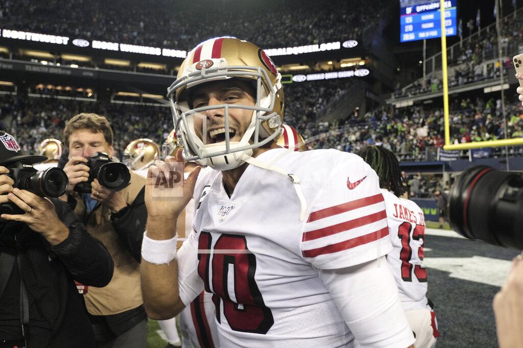 Stephen Brashear San Francisco 49ers quarterback Jimmy Garoppolo smiles after his team beat the Seattle Seahawks in an NFL football game, Sunday, Dec. 29, 2019, in Seattle. (AP Photo/Stephen Brashear)
