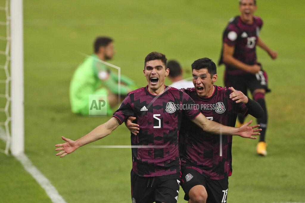 Mexico's Johan Vasquez celebrates scoring his side's 2nd goal against Canada during a Concacaf Men's Olympic qualifying championship semi-final soccer match in Guadalajara, Mexico, Sunday, March 28, 2021. Mexico won the match 2-0 and qualified for the Tokyo Olympics. (AP Photo/Fernando Llano)