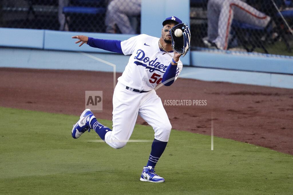 Jae C. Hong Los Angeles Dodgers' Mookie Betts catches a fly ball hit by San Francisco Giants' Mike Yastrzemski during the first inning of a baseball game Sunday, July 26, 2020, in Los Angeles. (AP Photo/Jae C. Hong)