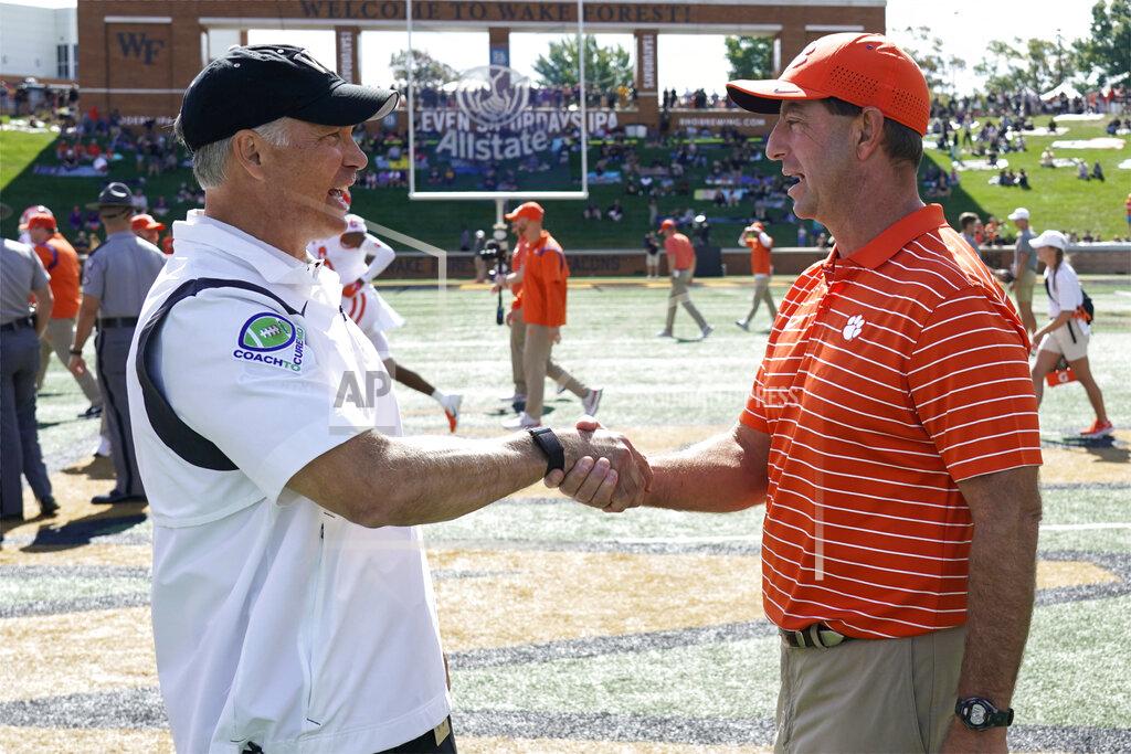 Chuck Burton Clemson head coach Dabo Swinney, right, greets Wake Forest head coach Dave Clawson before an NCAA college football game in Winston-Salem, N.C., Saturday, Sept. 24, 2022. (AP Photo/Chuck Burton)