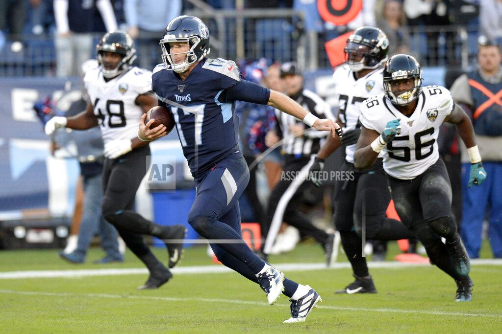 Mark Zaleski Tennessee Titans quarterback Ryan Tannehill (17) runs 21 yards for a touchdown against the Jacksonville Jaguars in the first half of an NFL football game Sunday, Nov. 24, 2019, in Nashville, Tenn. (AP Photo/Mark Zaleski)