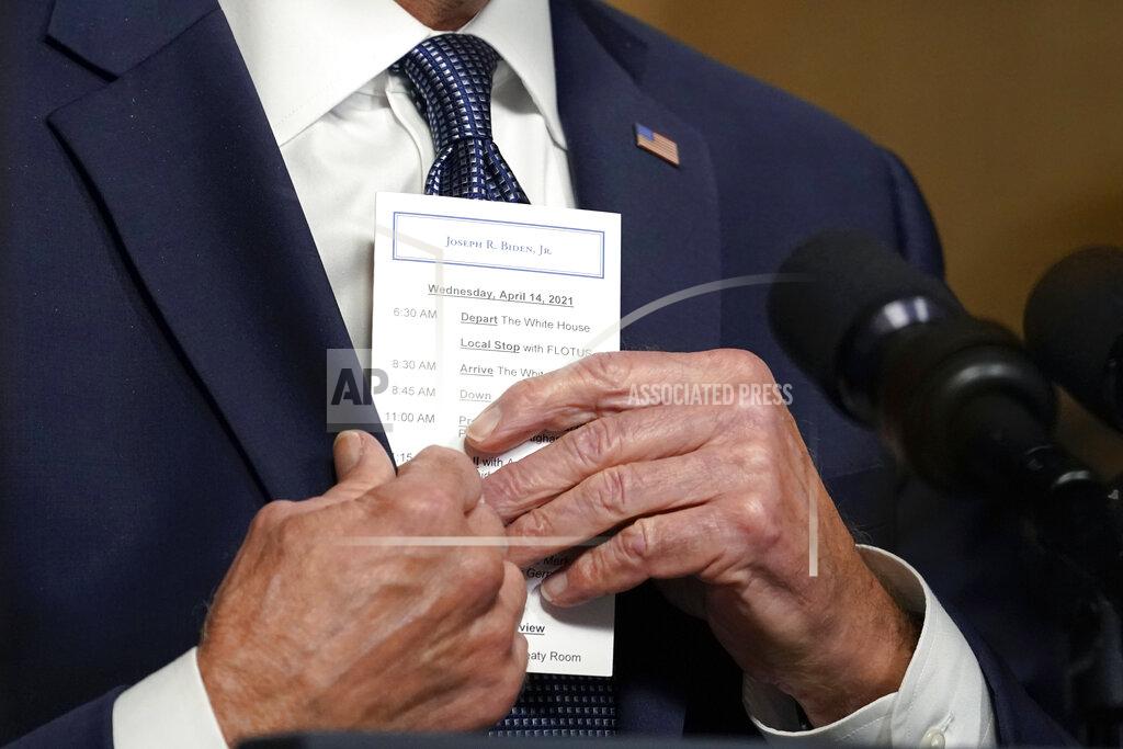 Andrew Harnik FILE - In this April 14, 2021, file photo President Joe Biden puts a card into his pocket as he speaks from the Treaty Room in the White House about the withdrawal of the remainder of U.S. troops from Afghanistan. (AP Photo/Andrew Harnik, Pool, File)