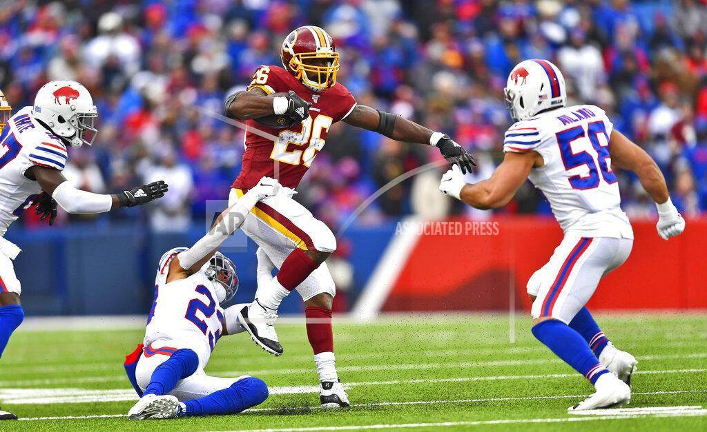 Adrian Kraus Washington Redskins running back Adrian Peterson (26) rushes for a first down against the Buffalo Bills during the first half of an NFL football game, Sunday, Nov. 3, 2019, in Orchard Park, N.Y. (AP Photo/Adrian Kraus)