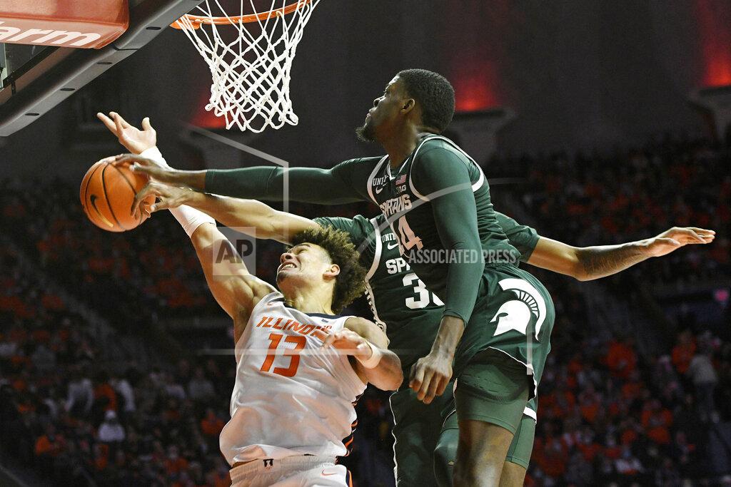 Michael Allio Michigan State's Gabe Brown (44) and Marcus Bingham Jr. (30) block the shot of Illinois' Benjamin Bosmans-Verdonk during the first half of an NCAA college basketball game Tuesday, Jan. 25, 2022, in Champaign, Ill. (AP Photo/Michael Allio)