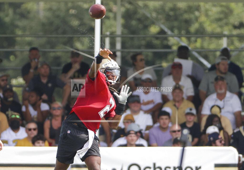 New Orleans Saints quarterback Jameis Winston (2) throws as fans watch practice from stands during NFL football training camp in Metairie, La., Saturday, July 31, 2021. (AP Photo/Derick Hingle)