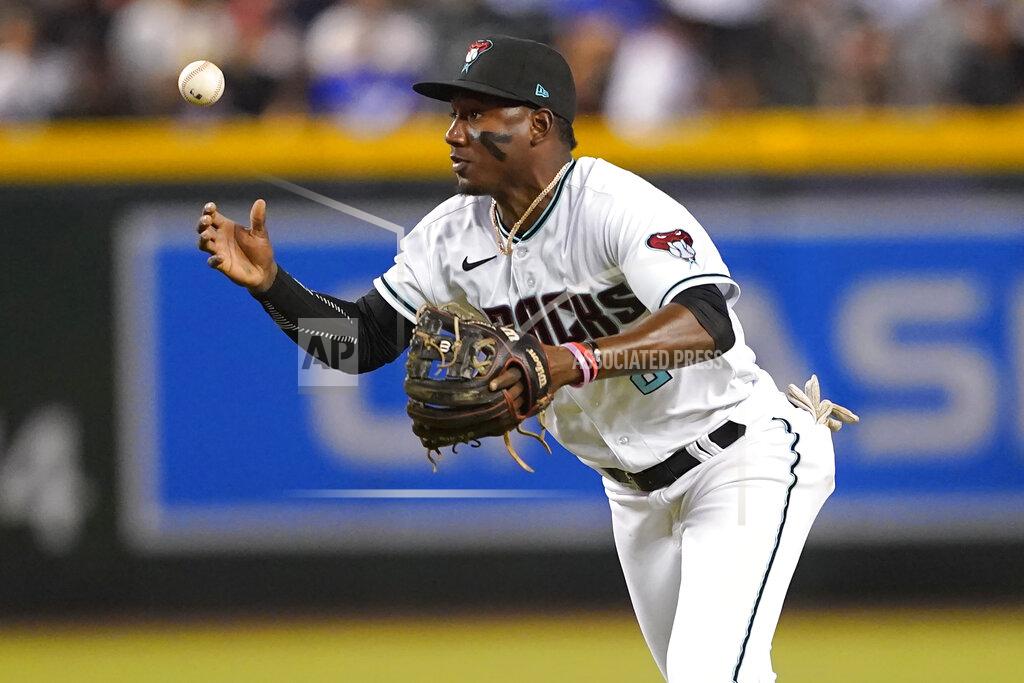 Matt York Arizona Diamondbacks' Geraldo Perdomo can't field a base hit by Los Angeles Dodgers' Gavin Lux during the third inning of a baseball game, Thursday, May 26, 2022, in Phoenix. (AP Photo/Matt York)