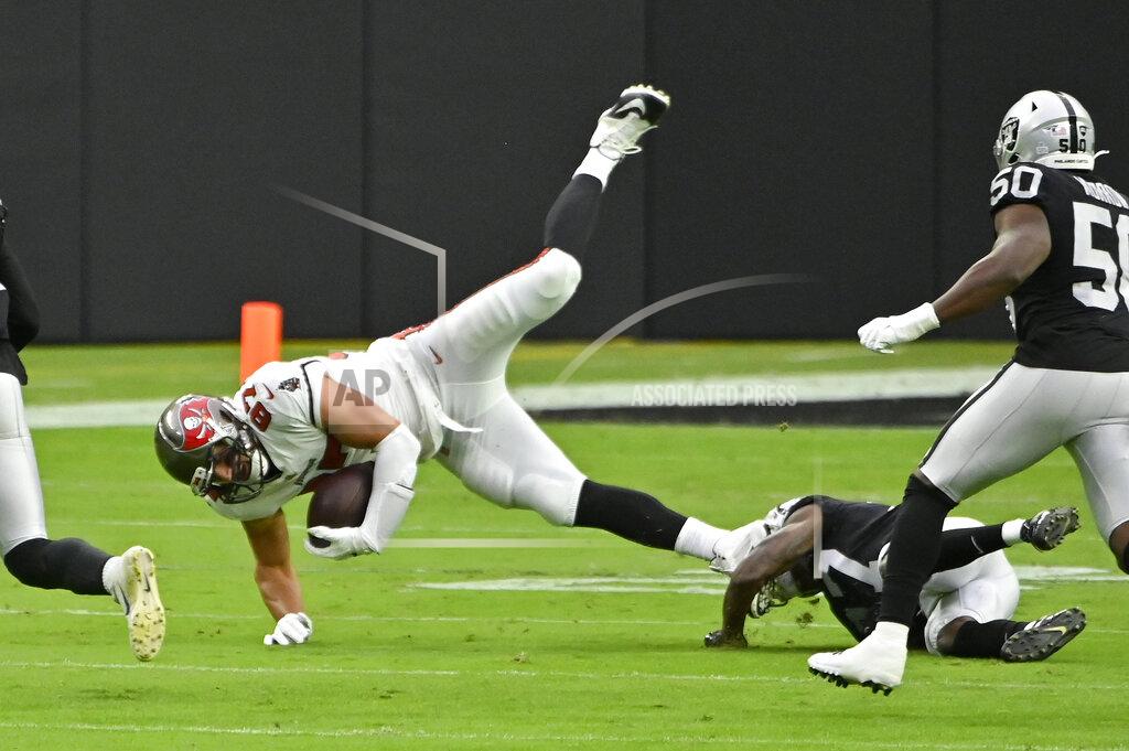 David Becker Las Vegas Raiders cornerback Trayvon Mullen (27) tackles Tampa Bay Buccaneers tight end Rob Gronkowski (87) during the first half of an NFL football game, Sunday, Oct. 25, 2020, in Las Vegas. (AP Photo/David Becker)