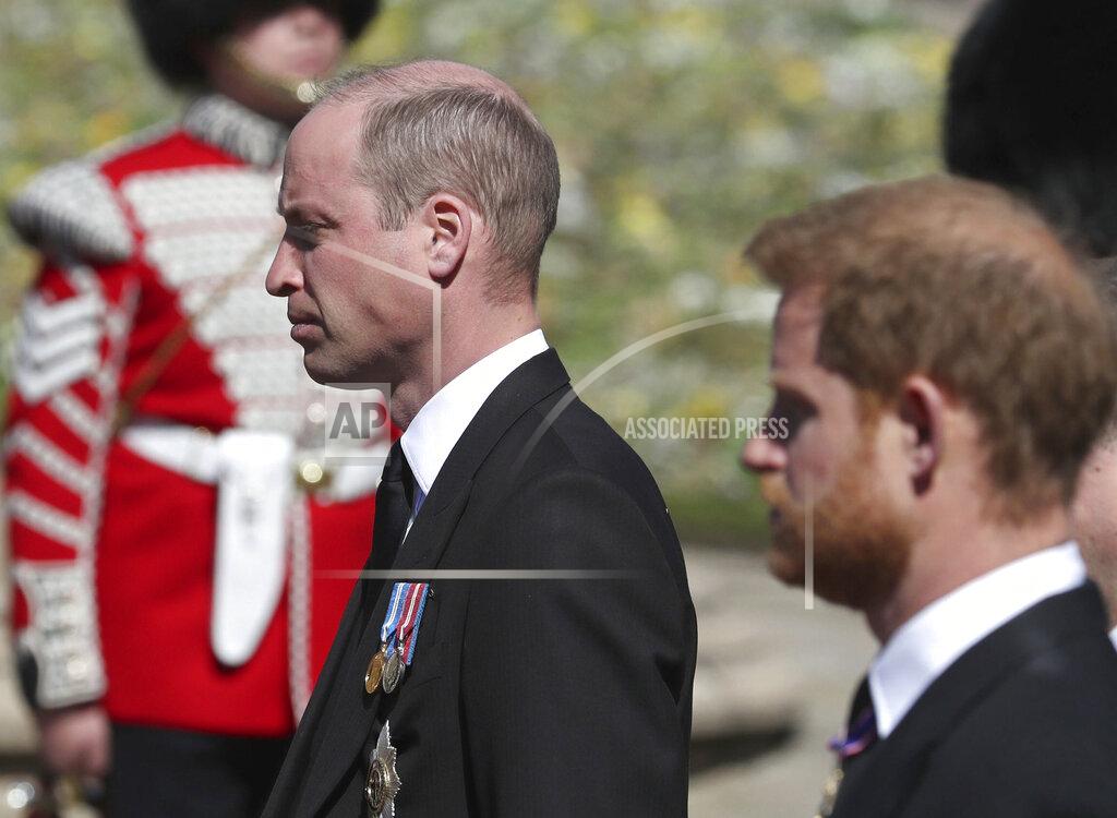 Gareth Fuller Britain's Prince William, left, and Prince Harry follow the coffin as it slowly makes its way in a ceremonial procession during the funeral of Britain's Prince Philip inside Windsor Castle in Windsor, England, Saturday, April 17, 2021. (Gareth Fuller/Pool via AP)