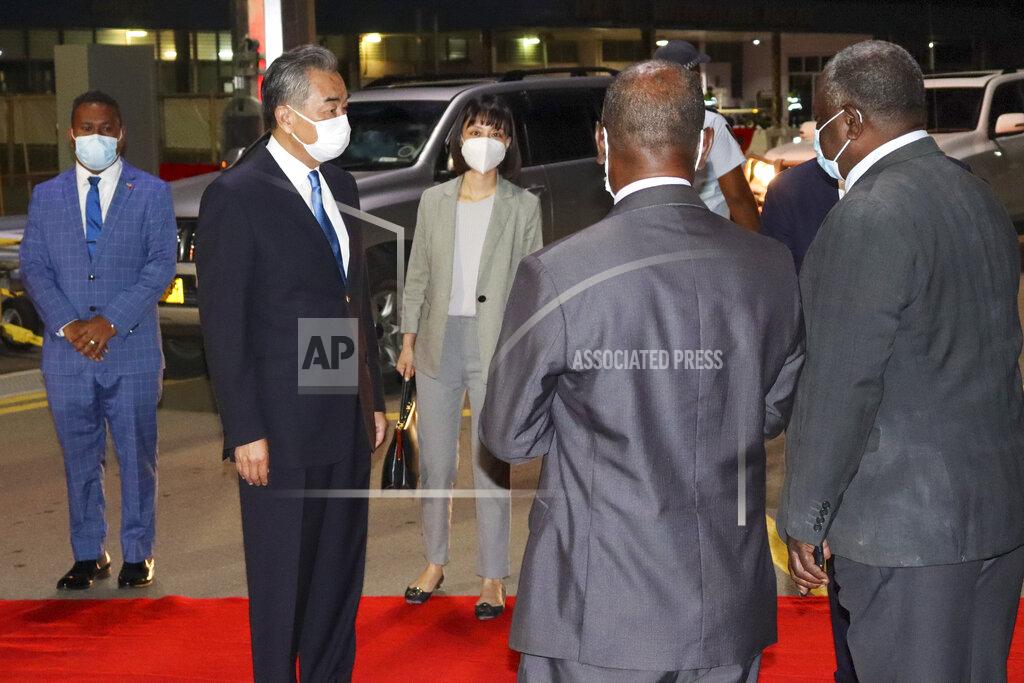 Uncredited China's Foreign Minister Wang Yi, second left, is met by Solomon Islands government ministers on his arrival in Honiara, Solomon Islands, early Thursday, May 26, 2022. Wang and a 20-strong delegation arrived in the Solomon Islands Thursday at the start of an eight-nation tour that comes amid growing concerns about Beijing’s military and financial ambitions in the South Pacific region. (AP Photo)