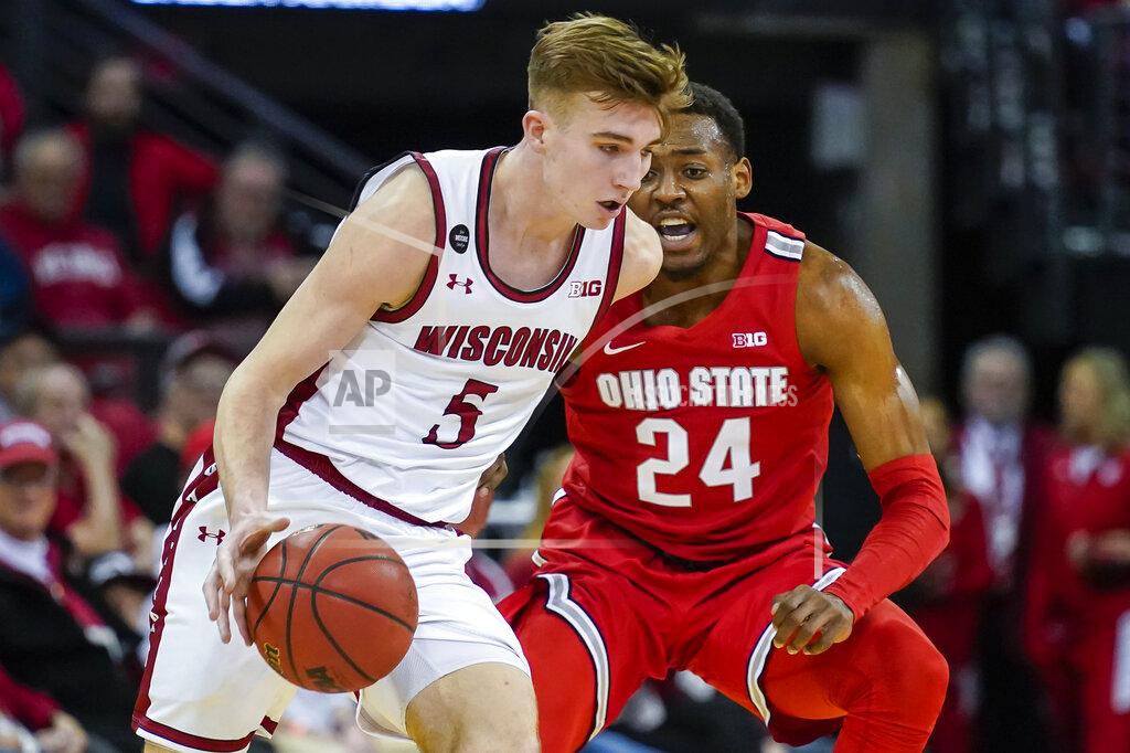 Andy Manis Wisconsin's Tyler Wahl (5) drives against Ohio State's Andre Wesson (24) during the first half of an NCAA college basketball game Sunday, Feb. 9, 2020, in Madison, Wis. (AP Photo/Andy Manis)