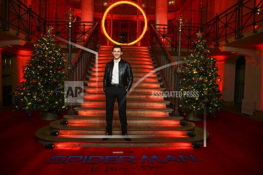 Tom Holland poses for photographers at the photo call for the film 'Spider-Man: No Way Home' in London Sunday, Dec. 5, 2021. (Photo by Joel C Ryan/Invision/AP)
