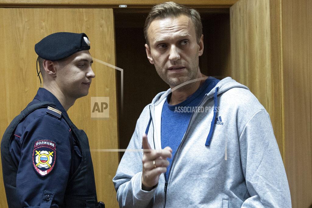 Pavel Golovkin FILE - In this Monday, Aug. 27, 2018 file photo, Russian opposition leader Alexei Navalny gestures while speaking in a court room in Moscow, Russia. Russian opposition politician Alexei Navalny was placed on a ventilator in a hospital intensive care unit in Siberia after falling ill from suspected poisoning during a flight, his spokeswoman said Thursday Aug. 20, 2020. (AP Photo/Pavel Golovkin, File)