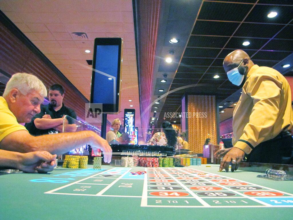 Wayne Parry This June 23, 2021 photo shows a game of roulette under way at Bally's casino in Atlantic City, N.J. Figures released on Thursday, Sept. 16, 2021 show the Atlantic City casinos and the three racetracks that offer sports betting collectively won over $427 million in August, 31% more than they did in August 2020 as the casinos were just emerging from coronavirus-related closures. (AP Photo/Wayne Parry)