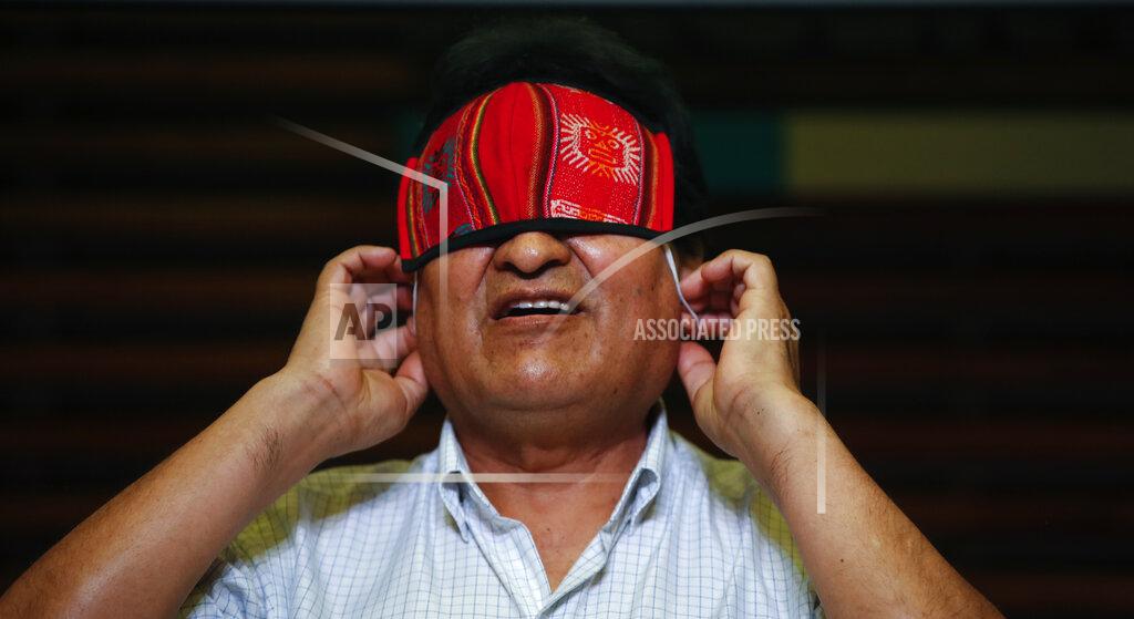 Natacha Pisarenko Former Bolivian President Evo Morales puts on his mask, amid the COVID-19 pandemic, after giving a press conference in Buenos Aires, Argentina, one day after general elections in his home country, Monday, Oct. 19, 2020. Morales’ party claimed victory in a presidential election that appeared to reject the right-wing policies of the interim government that took power in Bolivia after the leftist leader resigned and fled the country a year ago. (AP Photo/Natacha Pisarenko)