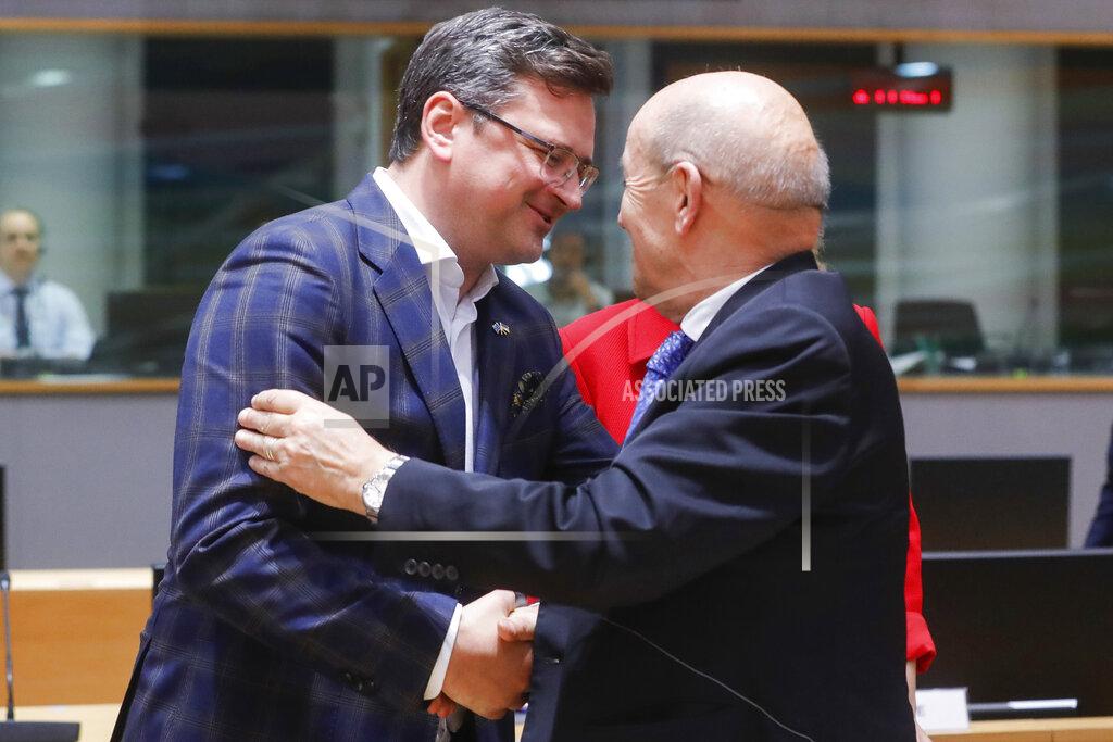 Olivier Matthys Ukraine's foreign minister Dmytro Kuleba, left, is welcomed by foreign minister of France Jean-Yves Le Drian at a meeting of EU foreign ministers at the European Council building in Brussels, Monday, May 16, 2022. European Union foreign ministers on Monday will discuss current affairs and have an exchange of views on the Russian aggression against Ukraine and the Global Gateway. (Stephanie Lecocq/Pool Photo via AP)
