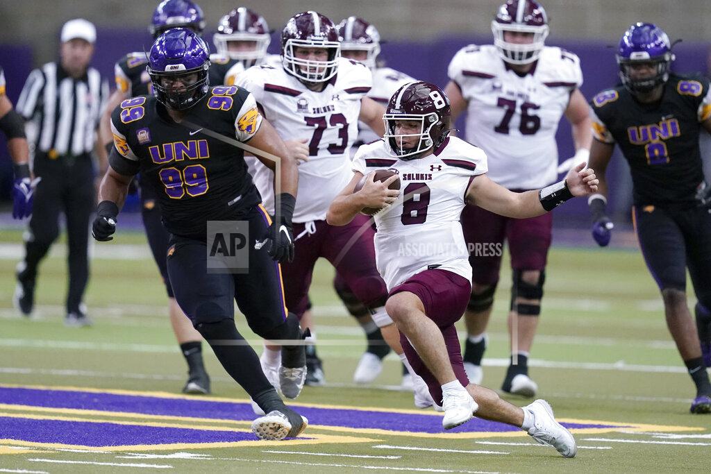 Charlie Neibergall Southern Illinois quarterback Nic Baker (8) runs from Northern Iowa defensive lineman Khristian Boyd (99) during the first half of an NCAA college football game, Saturday, Oct. 30, 2021, in Cedar Falls, Iowa. (AP Photo/Charlie Neibergall)