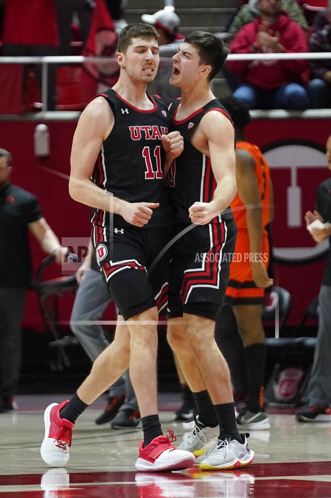 Rick Bowmer Utah's Riley Battin (11) celebrates with Lazar Stefanovic after scoring against Oregon State during the second half during an NCAA college basketball game Thursday, Feb. 3, 2022, in Salt Lake City. (AP Photo/Rick Bowmer)