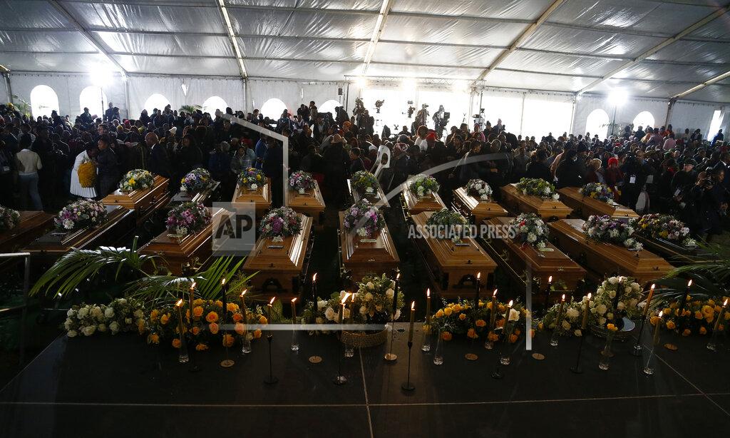Uncredited A view of the coffins during a funeral service held in Scenery Park, East London, South Africa, Wednesday, July 6, 2022. More than a thousand grieving family and community members are attending the funeral in South Africa's East London for 21 teenagers who died in a mysterious tragedy at a nightclub nearly two weeks ago. South African President Cyril Ramaphosa is due to give the eulogy for the young who died. (AP Photo)