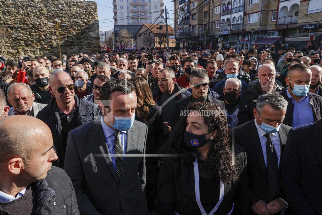 Visar Kryeziu Leader of the Vetevendosje (Self-determination) political party and candidate for the prime minister Albin Kurti, center left, and acting Kosovo's president Vjosa Osmani, center right, attend an electoral rally in the town Vushtri of Kosovo, on Friday, Feb. 5, 2021. Kosovo holds an early general election on upcoming Sunday Feb. 14, amid the coronavirus pandemic, economic downturn and stalled negotiations with wartime foe Serbia. (AP Photo/Visar Kryeziu)