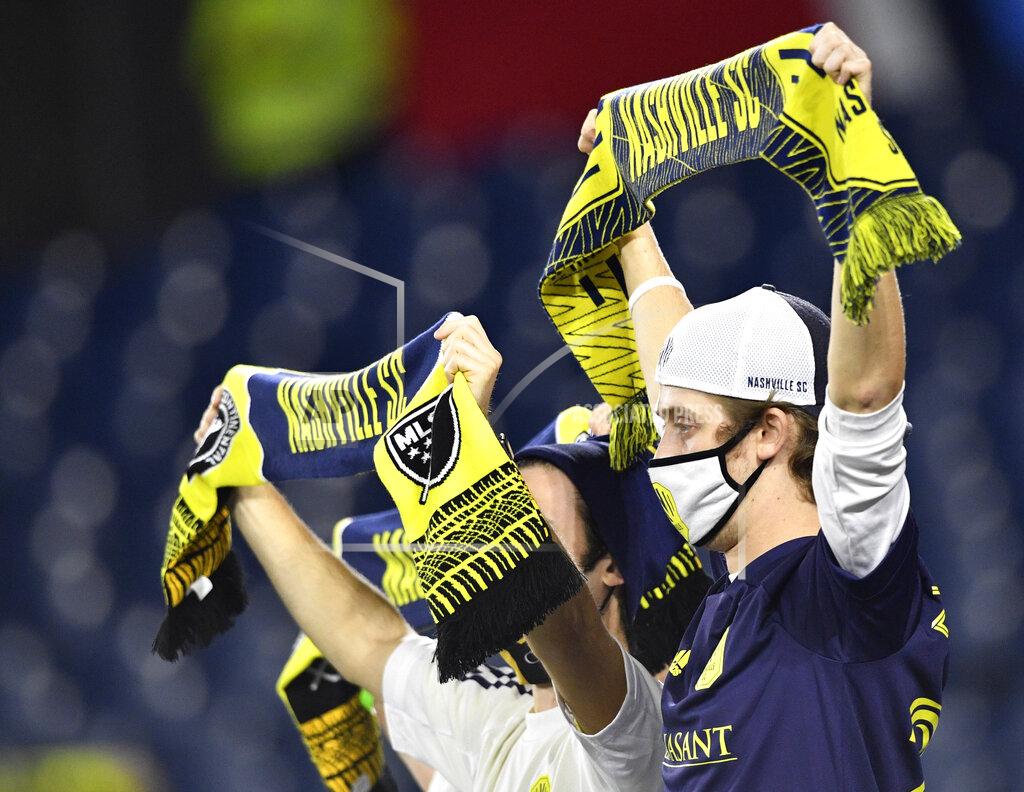 Larry Mccormack Nashville SC fans cheer on the team during an MLS soccer match against the Chicago Fire in Nashville, Tenn., Saturday, Oct. 31, 2020. (Larry McCormack/The Tennessean via AP)