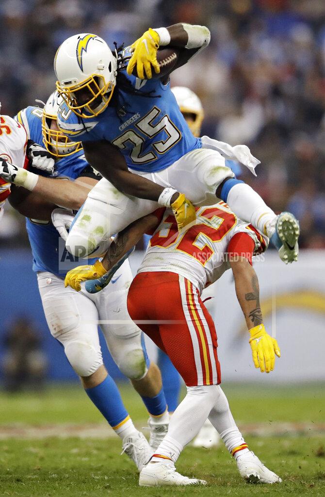 Marcio Jose Sanchez Los Angeles Chargers running back Melvin Gordon, above, leaps over Kansas City Chiefs strong safety Tyrann Mathieu during the first half of an NFL football game Monday, Nov. 18, 2019, in Mexico City. (AP Photo/Marcio Jose Sanchez)