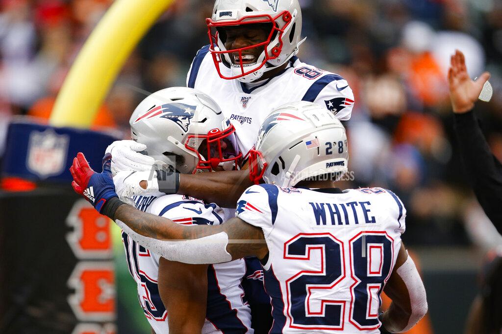 Gary Landers New England Patriots wide receiver N'Keal Harry, left, celebrates his touchdown in the second half of an NFL football game against the Cincinnati Bengals, Sunday, Dec. 15, 2019, in Cincinnati. (AP Photo/Gary Landers)