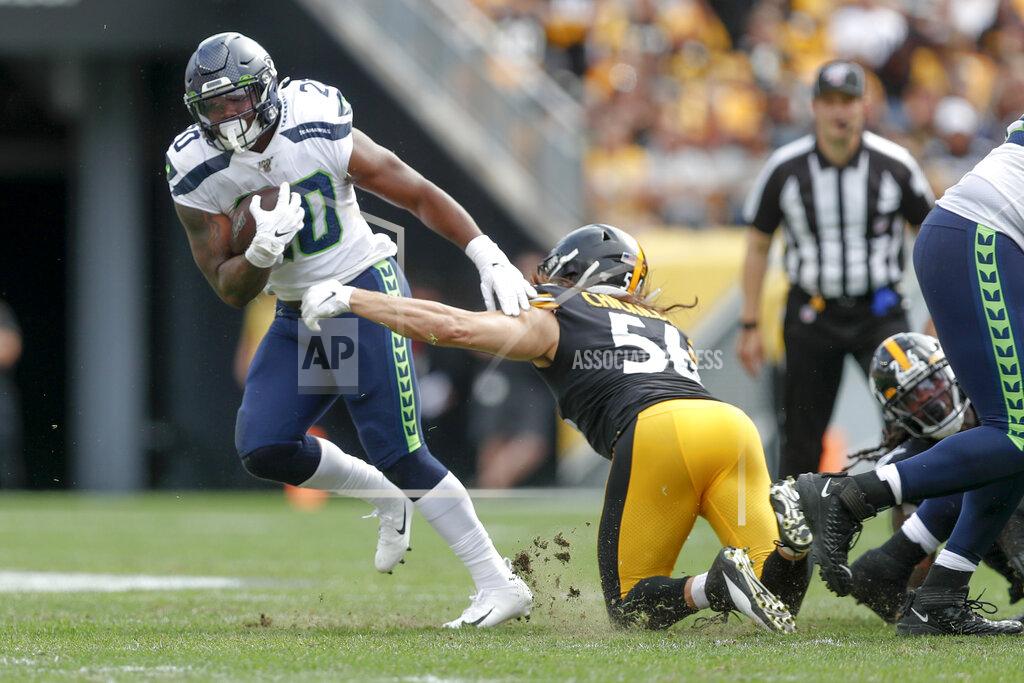 Don Wright Seattle Seahawks running back Rashaad Penny (20) breaks away from Pittsburgh Steelers linebacker Anthony Chickillo (56) on his way to a long touchdown run in the second half of an NFL football game, Sunday, Sept. 15, 2019, in Pittsburgh. (AP Photo/Don Wright)