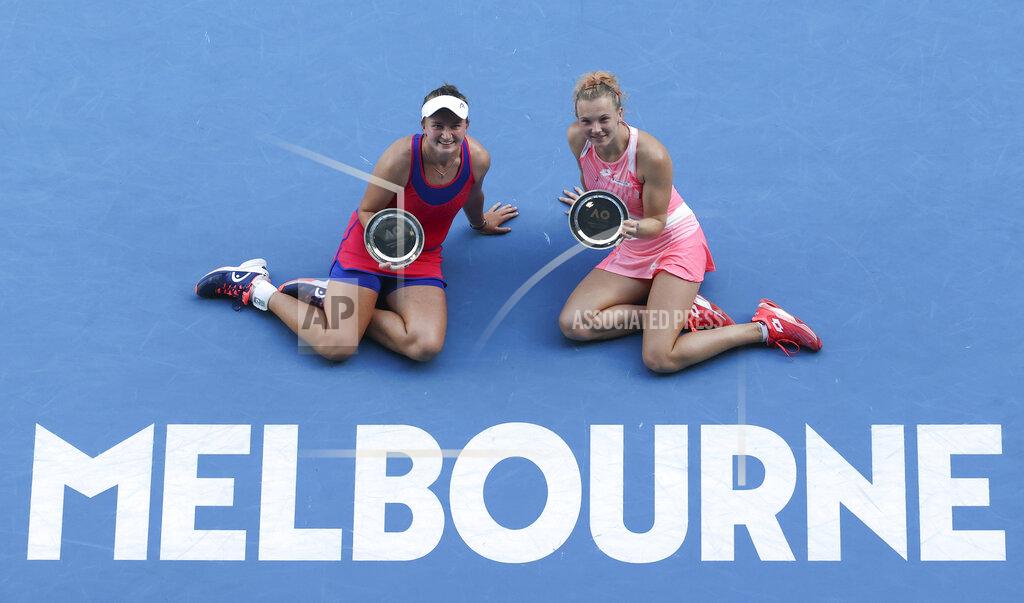Hamish Blair Barbora Krejcikova, left, and Katerina Siniakova of the Czech Republic hold their trophies after they lost to Belgium's Elise Mertens and Aryna Sabalenka of Belarus in the women's doubles final at the Australian Open tennis championship in Melbourne, Australia, Friday, Feb. 19, 2021.(AP Photo/Hamish Blair)