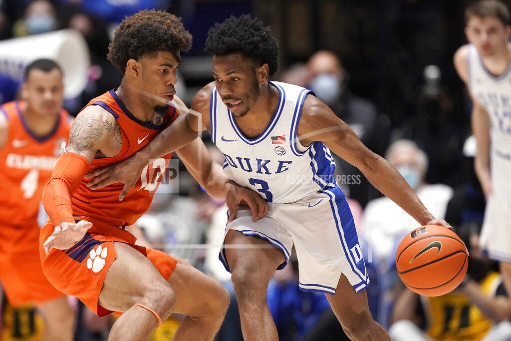 Gerry Broome Clemson guard David Collins (13) defends against Duke guard Jeremy Roach (3) during the first half of an NCAA college basketball game in Durham, N.C., Tuesday, Jan. 25, 2022. (AP Photo/Gerry Broome)