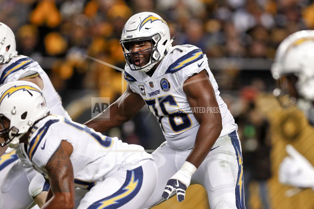 Don Wright FILE - In this Dec. 2, 2018, file photo, Los Angeles Chargers offensive tackle Russell Okung (76) plays against the Pittsburgh Steelers in an NFL football game in Pittsburgh. Okung took part in his first practice since June 1, 2019, when he suffered a pulmonary embolism during an offseason workout at the team facility. He is being treated for blood clots and has been on the non-football injury list. (AP Photo/Don Wright, File)